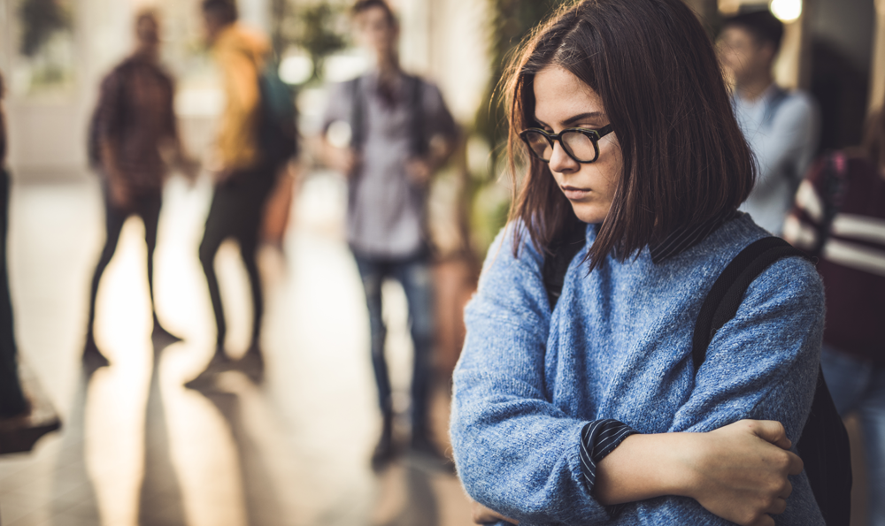 A teen LGBTQ student feels sad.